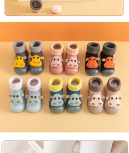 Colorful baby floor sock shoes featuring cute cartoon animal designs and non-slip soles