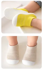 Detailed view of breathable knit toddler walking shoes with soft rubber soles
