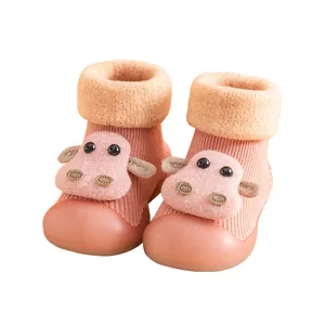 Pink baby walker shoes with anti-slip rubber soles and a cute 3D cartoon cow design