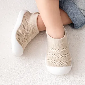 Comfortable beige mesh walking shoes with soft white soles for infants and toddlers