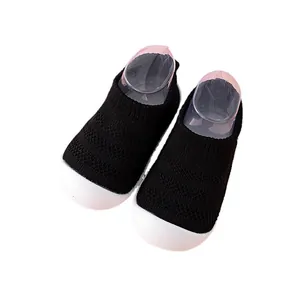 Breathable black mesh baby walking shoes with flexible soft white soles for toddlers