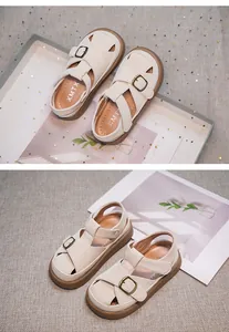 Detail view of girls' closed-toe sandals with soft soles and retro metal buckles