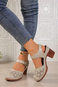 Stylish retro closed-toe block heel sandals featuring elegant hollow-out laser-cut design for women.