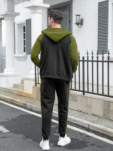 Back view of men's olive green and black color block hoodie and matching joggers set