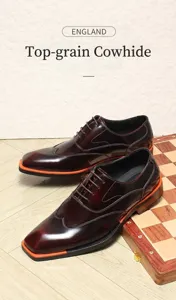 Premium burgundy burnished leather oxford shoes with stylish orange contrast soles.