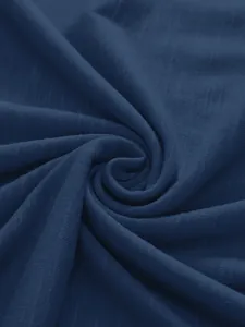 Nahaufnahme von dunkelblauem Flammgarn-Baumwollstoff mit einzigartigem Spiral-Detail