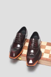 Men's burgundy leather Oxford shoes with square toe and orange sole detail