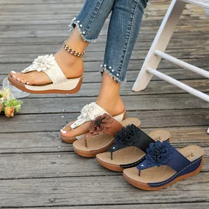 Detailed view of these stylish women's wedge flip-flops with multi-colored flowers