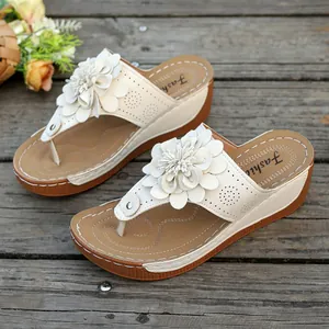 Women's summer floral wedge thong sandals with white petal accents and laser-cut detailing