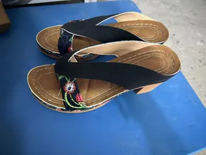 Women's floral embroidered wedge thong sandals with chunky heels and tan insoles.
