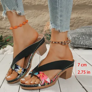 Detail view of chunky heel floral sandals for women with 7cm / 2.75 inch measurement labels.