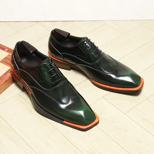 Close-up of men's dark green polished leather oxford shoes with square toe
