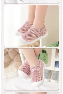 Detailed view of breathable pink mesh baby walking shoes featuring a flexible soft white sole