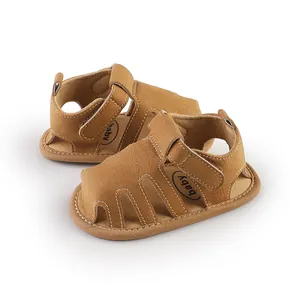 Sandali primi passi per neonati in camoscio marrone con chiusura in velcro e suola