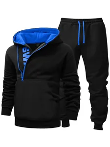 Detail showing men's black fleece tracksuit with vibrant blue side zipper hood