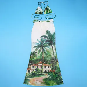 Three-piece tropical landscape print bikini set including a sheer mesh maxi beach skirt