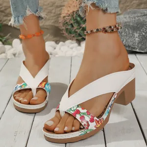 Stylish white floral print thong sandals featuring a chunky high heel and summer vibes
