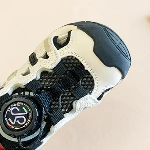 Close-up of kids' summer sandals featuring a quick-adjust dial buckle and breathable mesh