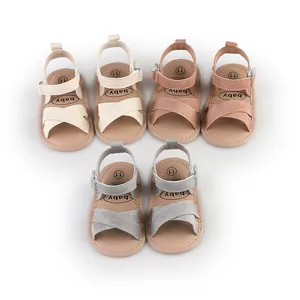 Multiple pairs of toddler summer walking sandals in cream, pink, and grey for infants