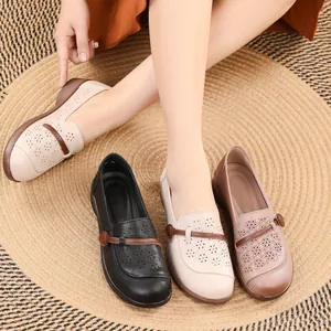 Retro hollow-out flat shoes for women with soft soles and ethnic flower patterns.