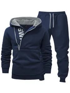 Navy blue men's tracksuit set featuring a side zipper hoodie and grey drawstring pants