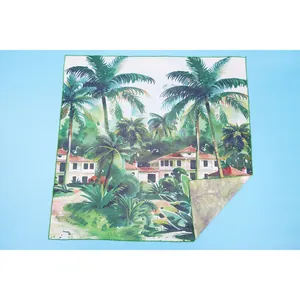 Detailed tropical palm tree print beach sarong wrap featuring a scenic villa landscape
