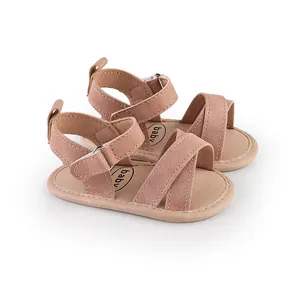 Detailed view of pink baby summer walking sandals with soft soles and cross straps