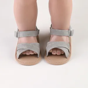 Grey suede-like baby summer sandals with cross straps and velcro ankle support