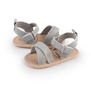 Soft grey suede baby sandals with adjustable Velcro straps for infants aged 0-1 year.