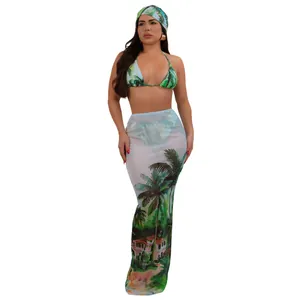 Detail of sexy three-piece bikini set with tropical print headscarf and mesh skirt