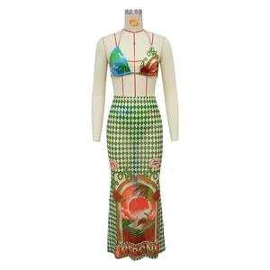 Detailed view of bikini top and checkered maxi skirt set with tropical sun print