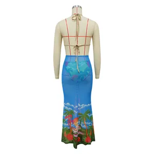 Back view of three-piece tropical print bikini set with sheer blue maxi skirt