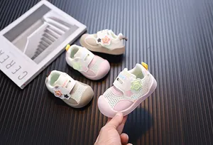 Close-up of breathable pink mesh toddler sneakers featuring a cute star velcro strap