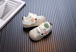 Close-up view of breathable mesh toddler sneakers with soft soles and cute star patterns