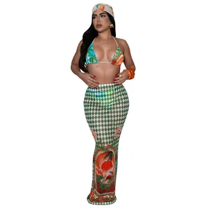 Detail showing a sexy two-piece bikini set with matching tropical print long skirt