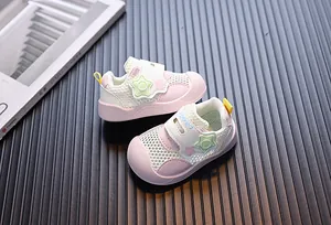Side view of pink breathable mesh toddler walking shoes with star-shaped decorations