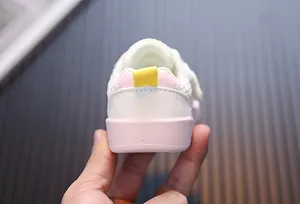 Rear view detail of breathable pink toddler walking shoes with soft sole