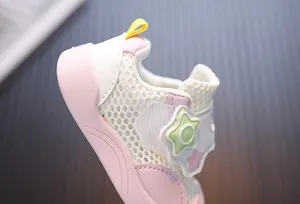 Close-up detail showing the breathable pink mesh and star decoration of toddler sneakers