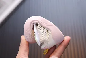 Detail view of breathable pink mesh toddler sneaker showing ultra-flexible soft sole