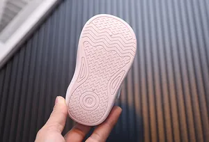 Close-up of pink soft-soled toddler shoe with size 18 anti-slip wave pattern