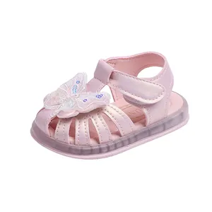 Stylish pink baby girl sandals featuring butterfly ornament and LED light-up sole
