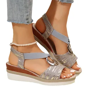 Stylish women's summer wedge sandals featuring metallic straps and double ring buckle