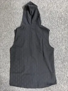 Detailed back view of men's sleeveless hooded shirt featuring a subtle jacquard texture
