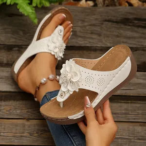 Elegant white wedge thong sandals with 3D flower decor for women's casual summer wear.