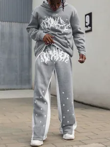 Full view of grey men's streetwear hoodie and sweatpants set with star graphics.