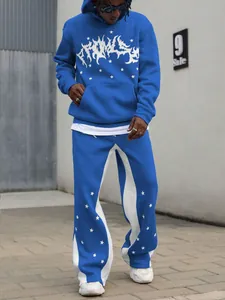 Detail of blue men's streetwear hoodie set with white star prints and graphic logo