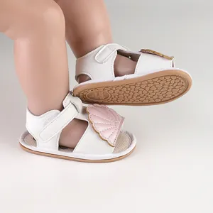 Detailed view showing the white baby summer sandals with pink shell and non-slip rubber sole