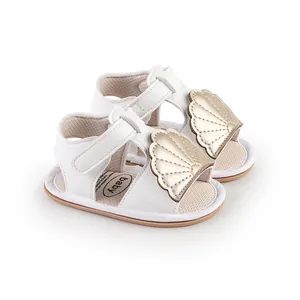 Elegant white baby summer walking sandals featuring gold shell decorations for infants 0-1 year