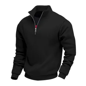 Detail view of a men's black half-zip sweatshirt with a cozy fleece lining for winter.