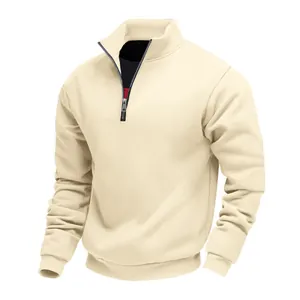 Close-up of men's cream quarter-zip sweatshirt featuring mock neck and ribbed cuffs